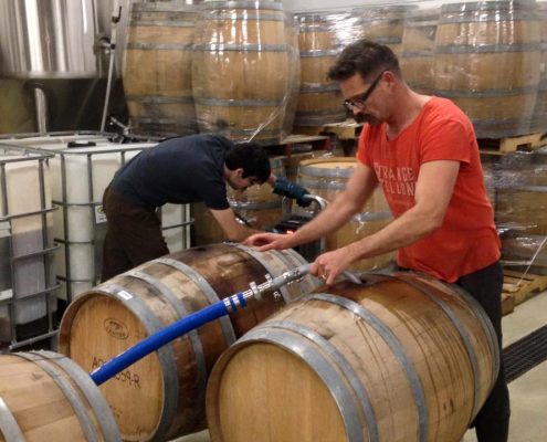 Vancouver Brewery Tours Inc. - Filling Barrels at Strange Fellows Brewing