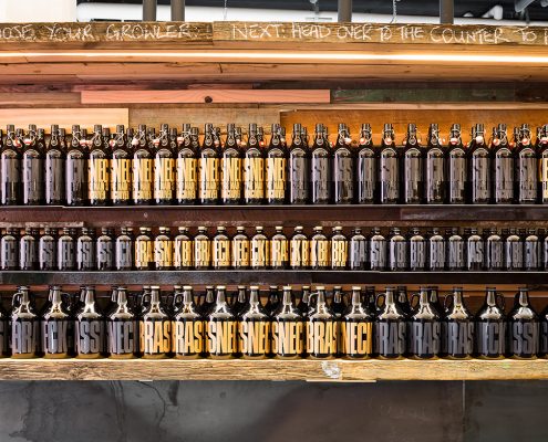Vancouver Brewery Tours Inc. -Growler wall at Brassneck Brewery