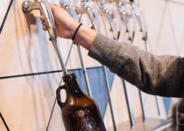 Dine Out Vancouver - Vancouver Brewery Tours - Luppolo Brewing Pouring Growlers